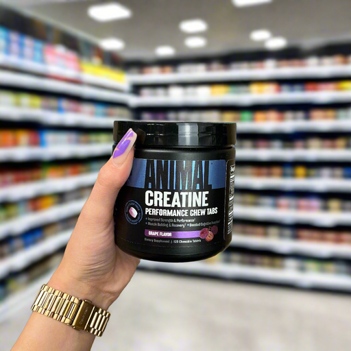Close-up of Animal Creatine Chews 120 Tablets) held up inside My Supplement Shop, clearly showing the front label in a Sports Nutrition setting.