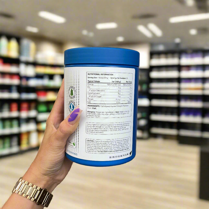 Close-up of (Applied Nutrition Unflavored Marine Collagen 300g) held up inside My Supplement Shop, clearly showing key ingredients on the packaging in a Sports Nutrition setting.