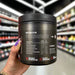 Close-up of (Conteh Sports Hydra Flow Daily Hydration Formula 300g) held up inside My Supplement Shop, clearly showing Nutritional Values on the packaging in a Sports Nutrition setting.